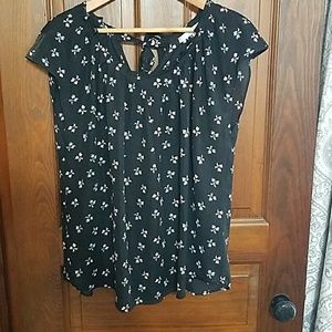 Black blouse with white and red bow pattern